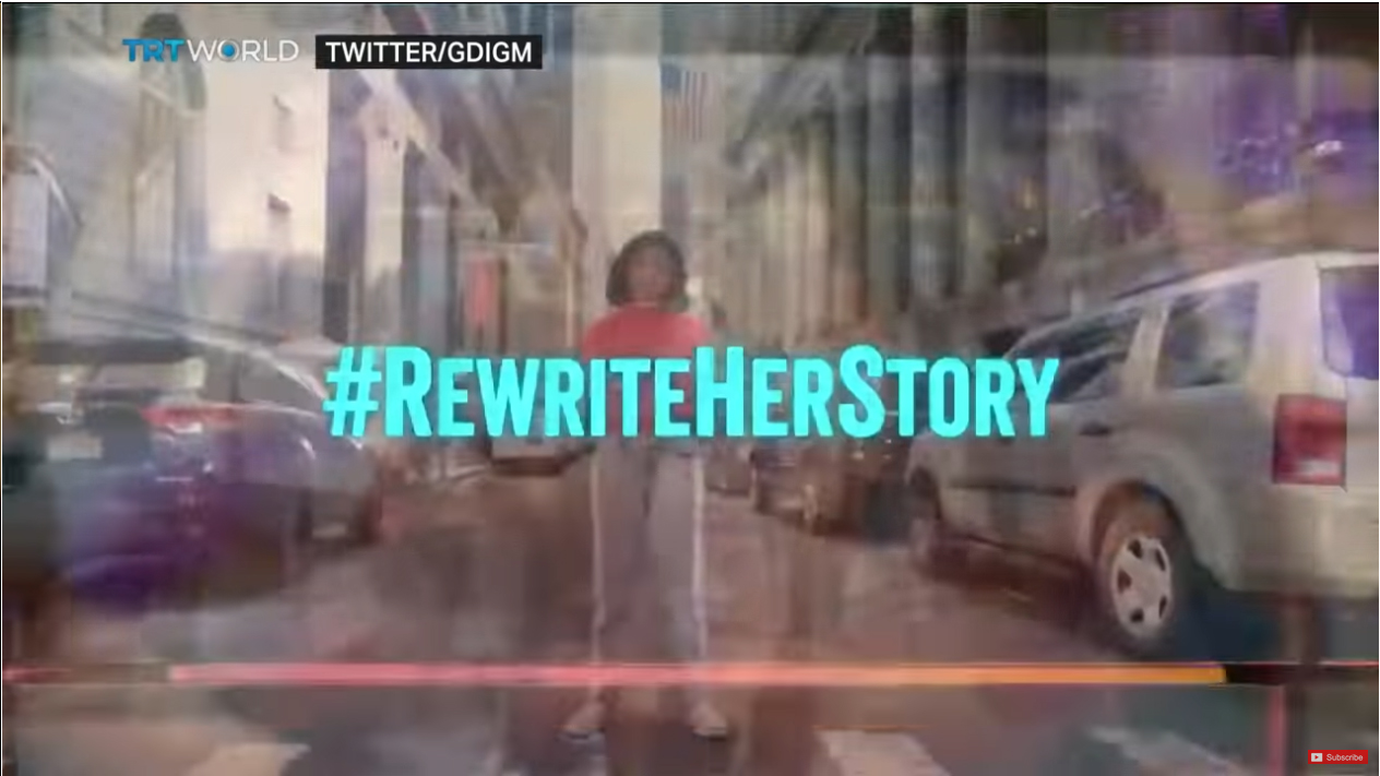 #Rewrite her Story tag on a movie still with a women standing centered on screen